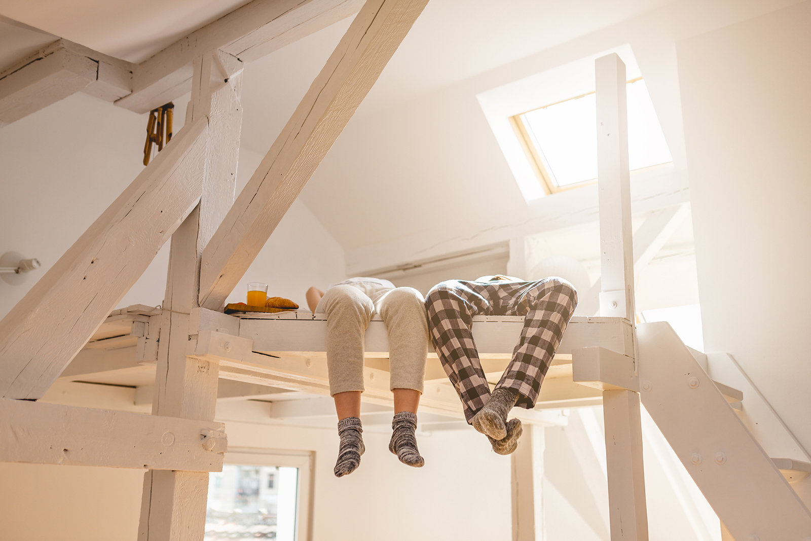 Beautiful and lovely couple enjoying their time by living together in a new apartment, relaxing in the morning.