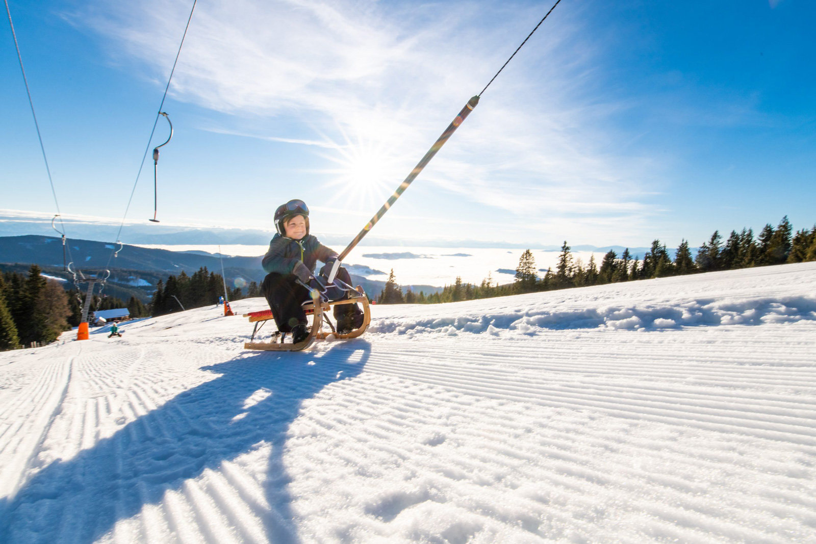Auf dem Schlitten nach oben: Schlepplift auf der Saualm